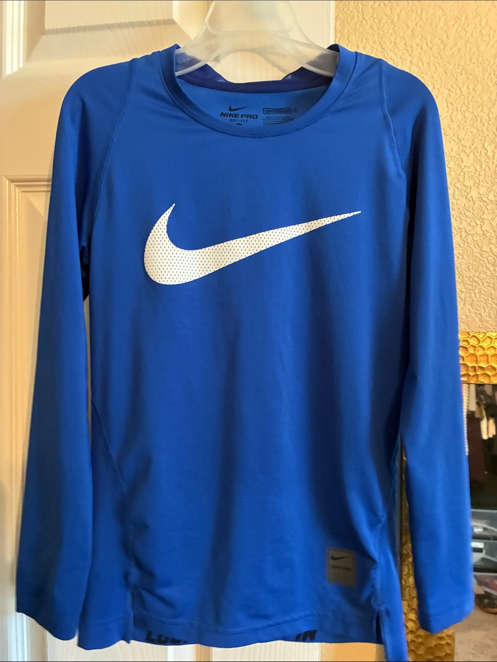 Nike Blue Long Sleeve Performance Top with White Swoosh